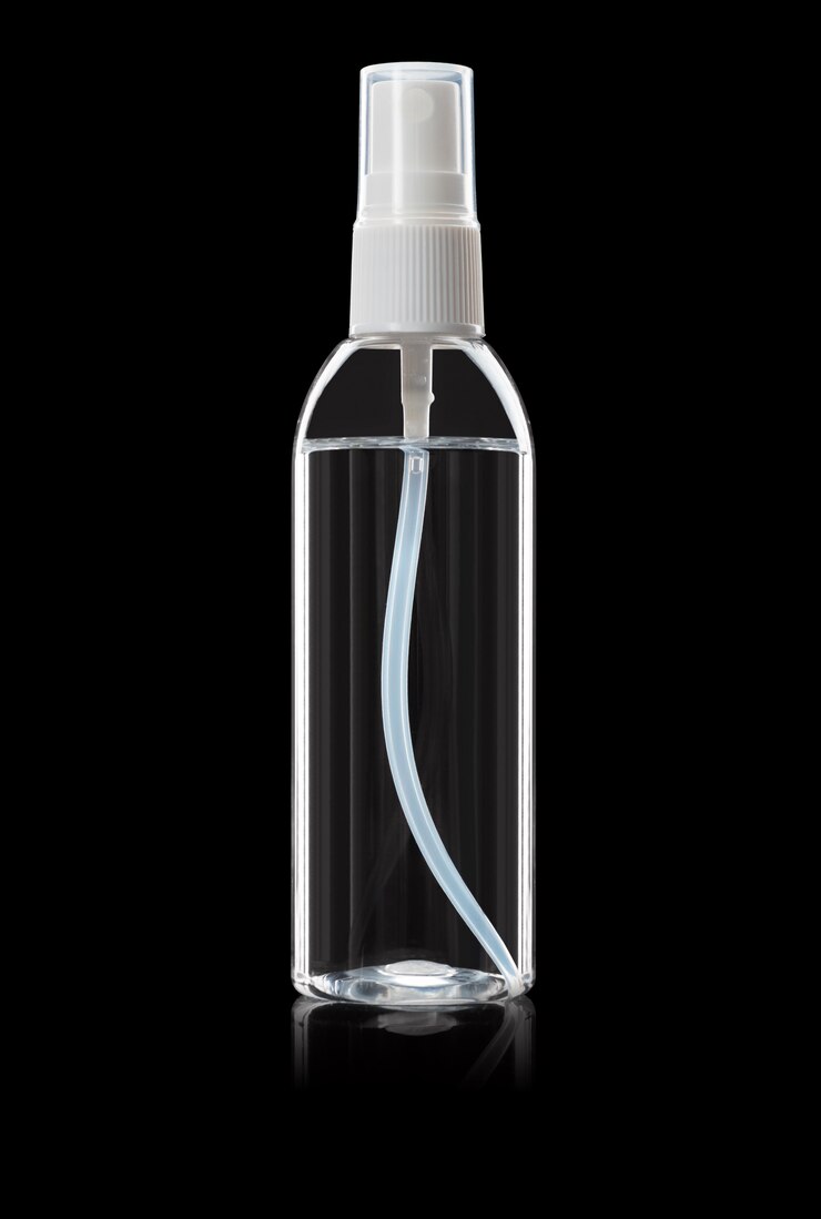 Photo bottle of instant antiseptic hand sanitizer transparent gel isolated on black background, no label.