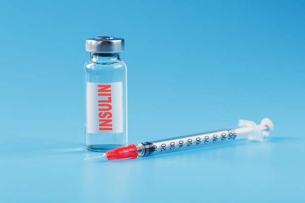 A bottle of insulin hormone and a syringe on the