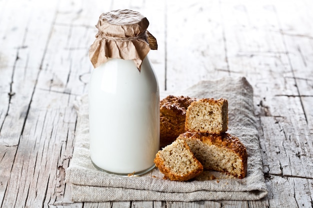 Bottle of milk and fresh baked bread 