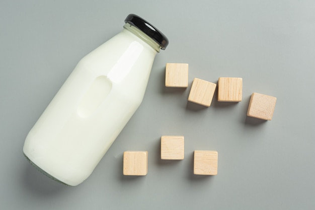 Bottle of milk on gray surface