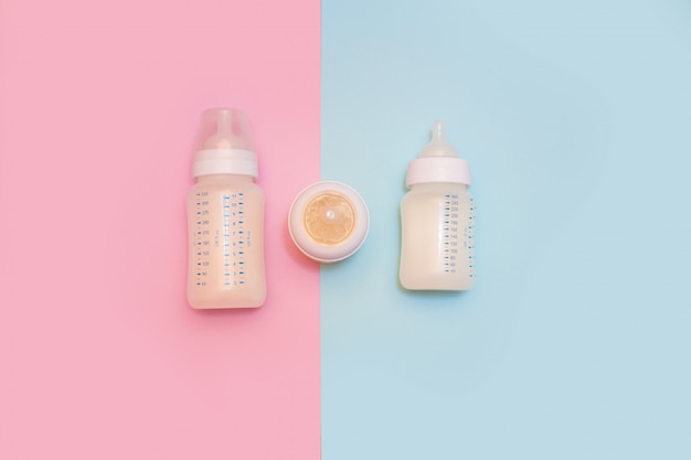 Bottle of milk or infant formula for a newborn  The concept of motherhood and child care. View from above.