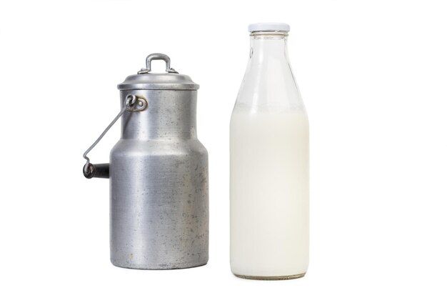 Bottle of milk and an old milk can isolated on a white background