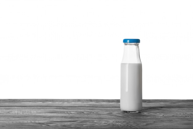 Bottle of milk on wooden table