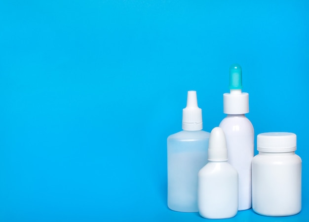 Bottle mockup on blue background. Bottle, container from pills, capsules.