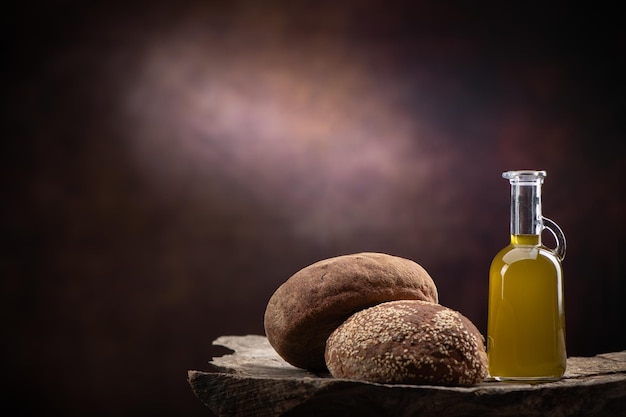 Bottle of olive oil with fresh bread