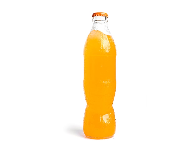 Bottle of orange soda isolated on white.