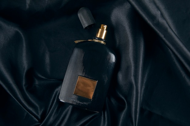 Bottle of perfume on black