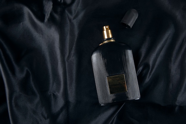 Bottle of perfume on black