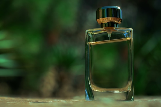 Bottle of perfume in greenery