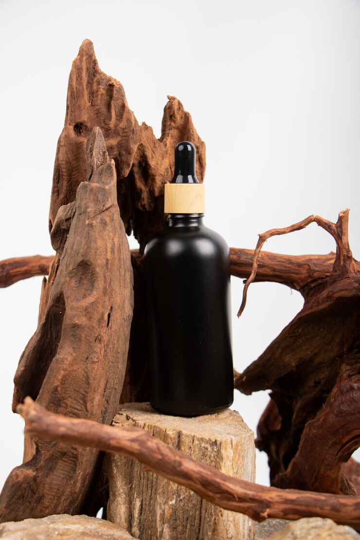 Photo a bottle of perfume sits on a stump