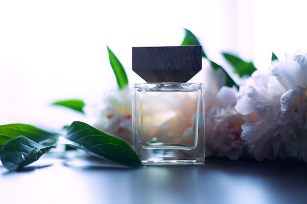 Bottle of Perfume and white flowers