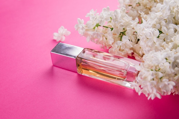 Bottle of perfume with lilac