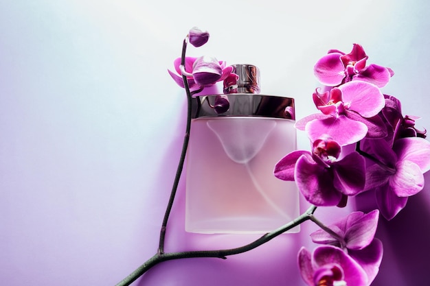 Bottle of perfume with orchid