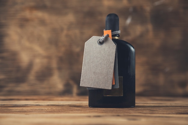 Bottle of perfume on the wooden table