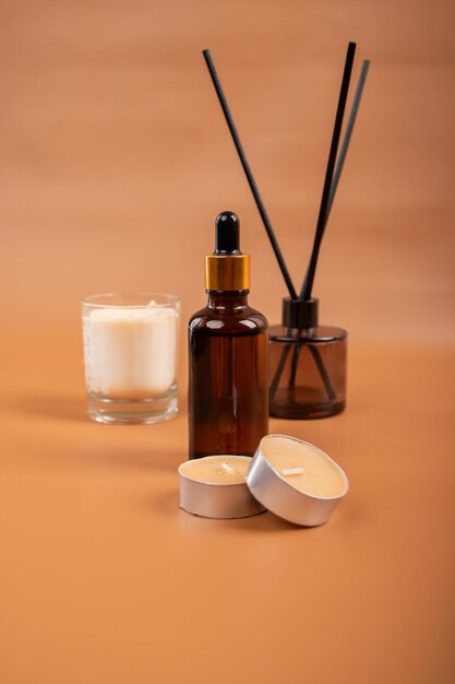 a bottle of serum next to a glass of water