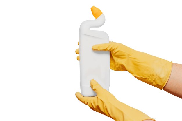 A bottle of toilet cleaner in the hands of those who wear thick yellow gloves