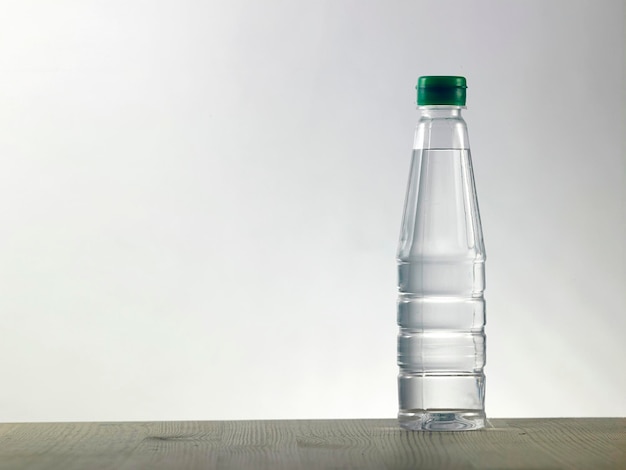 Bottle of white vinegar on the wood table