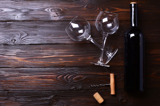 Bottle of wine and glasses on wooden