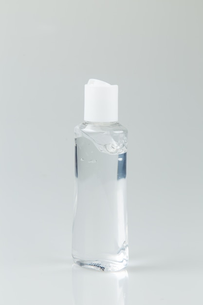 Bottle with antibacterial gel isoalted in light gray background