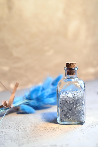 Bottle with decorative glass for decorating indoor plantsGray background