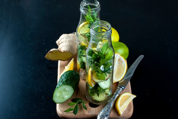 Bottle with detox fresh organic cucumber, lemon and mint water 