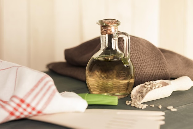 Bottle with fragrant sunflower oil and background with space for text