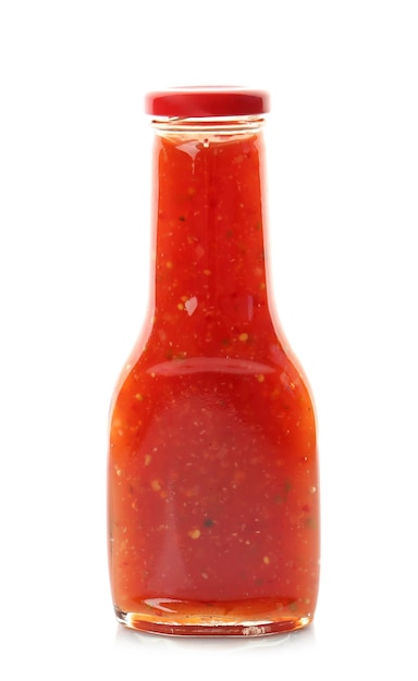 Bottle with tasty chili sauce on white background