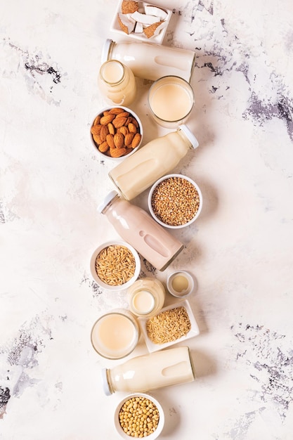 A bottles of alternative  milk and ingredients, top view.