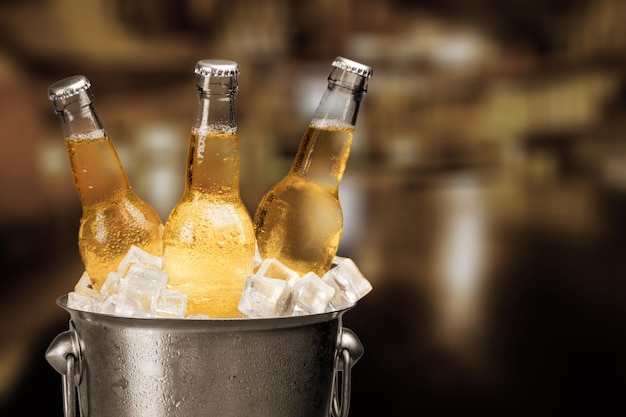 Bottles of cold and fresh beer with ice isolated