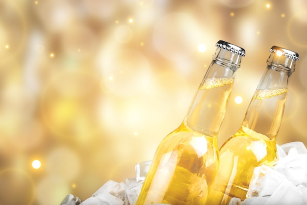 Bottles of cold and fresh beer with ice isolated