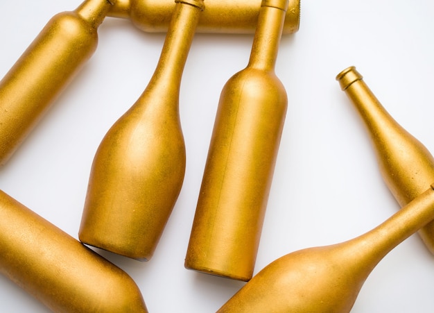 Bottles of different shapes in gold