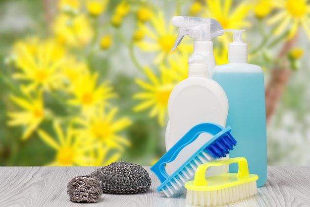 Bottles of dishwashing liquid brushes and sponges