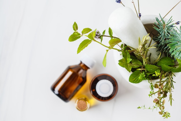 Bottles of essential oil, white background. Healthy cosmetics concept.