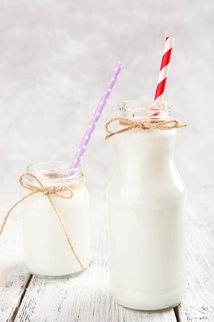 Bottles of milk on wooden table