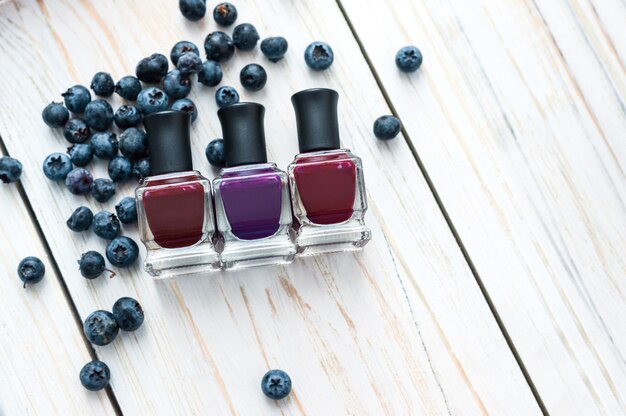 Bottles of nail polish on a wooden table