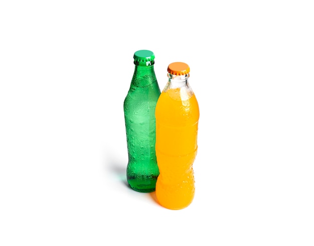 Bottles of soda isolated on white. Three multicolored soda bottles.