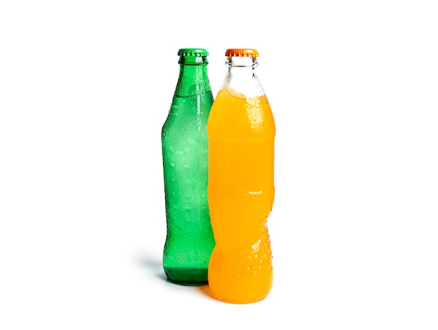 Bottles of soda isolated on white. Three multicolored soda bottles.