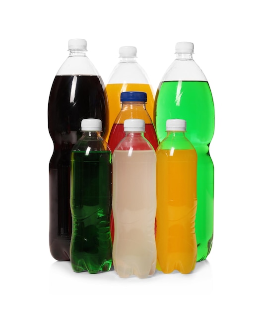 Bottles of soft drinks on white background