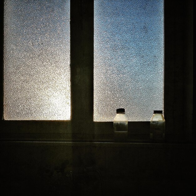 Photo bottles on window sill