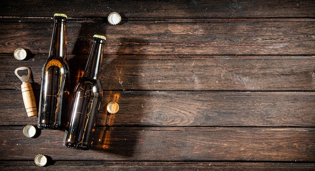 Photo bottles with beer and opener