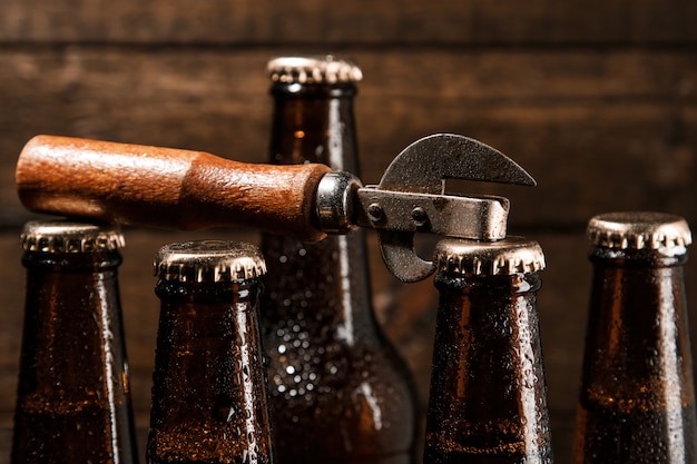 Bottles with beer and vintage opener