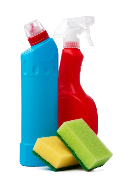 Bottles with cleaning products and sponge on a white isolated background