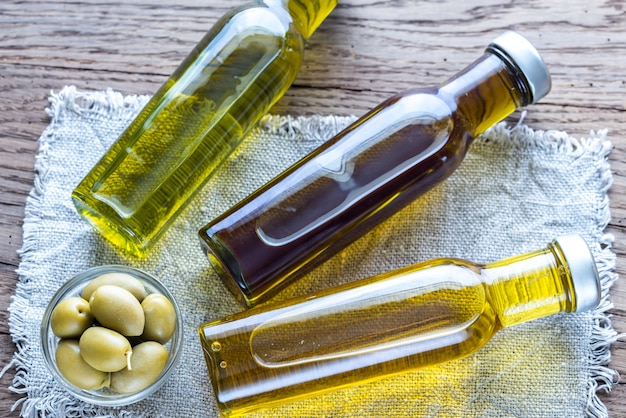 Bottles with different kinds of olive oil