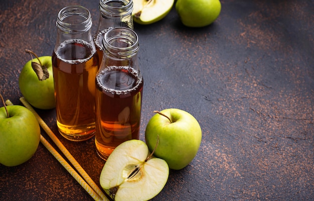 Bottles with fresh apple juice 