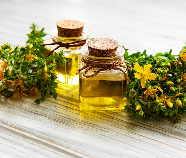 Bottles with St. John's wort extract on the wooden table