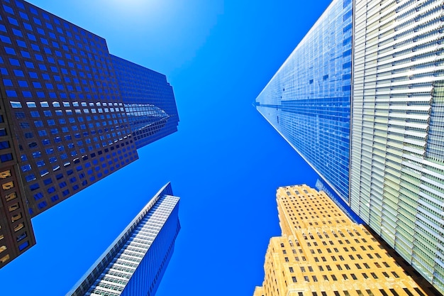 Bottom up view of Freedom Tower and World Financial Center in Financial District in Lower Manhattan, New York, USA