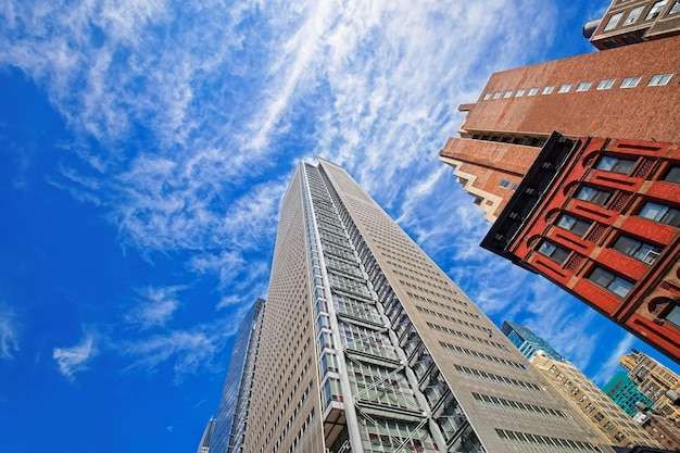 Bottom up view of skyscrapers in New York, USA. New York City skyscrapers are concentrated in Manhattan, although the boroughs of Brooklyn, Queens, and the Bronx also have a few highrises