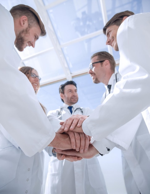 Bottom view close up of a doctors folded their hands together