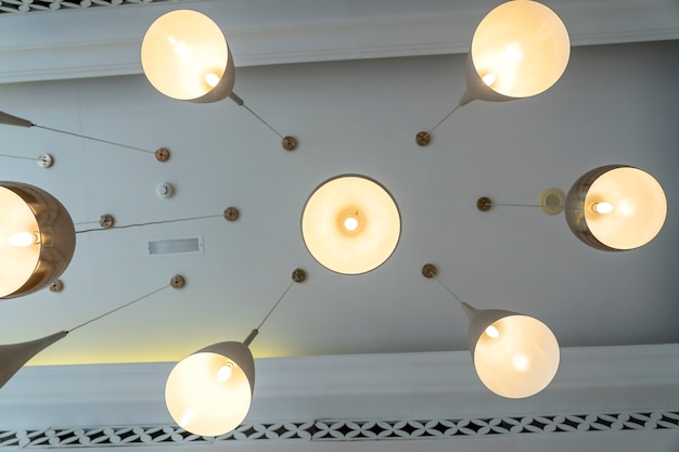 Bottom view of modern ceiling lights. Lighting decoration concept. Modern hanging ceiling lamps