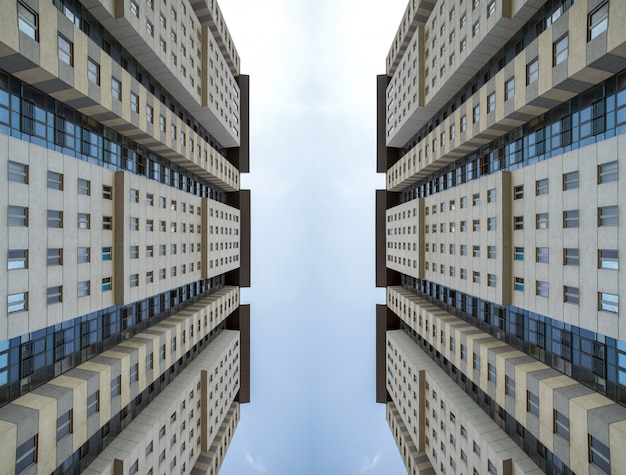 Vista dal basso sul grattacielo nel cielo blu